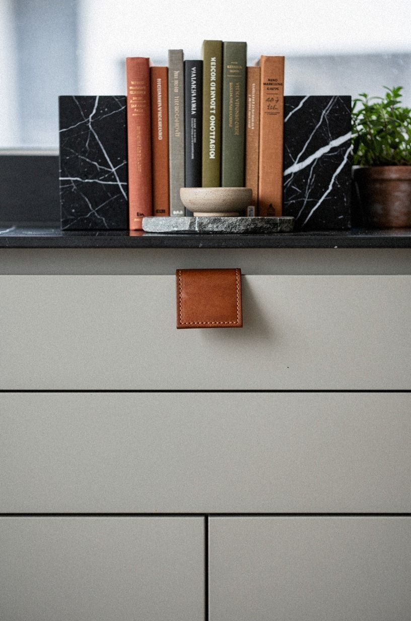 Mix cookbooks with small marble bookends