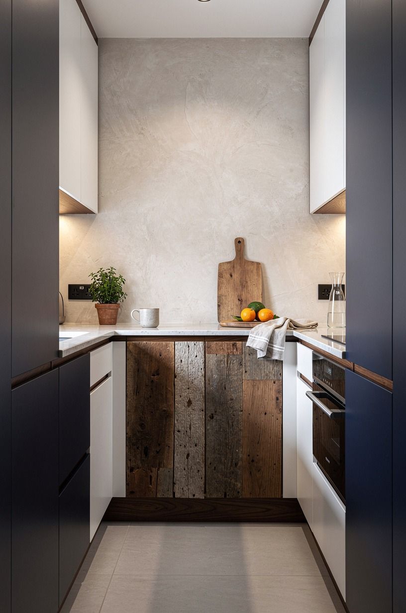 Break the cabinet run with warm wood