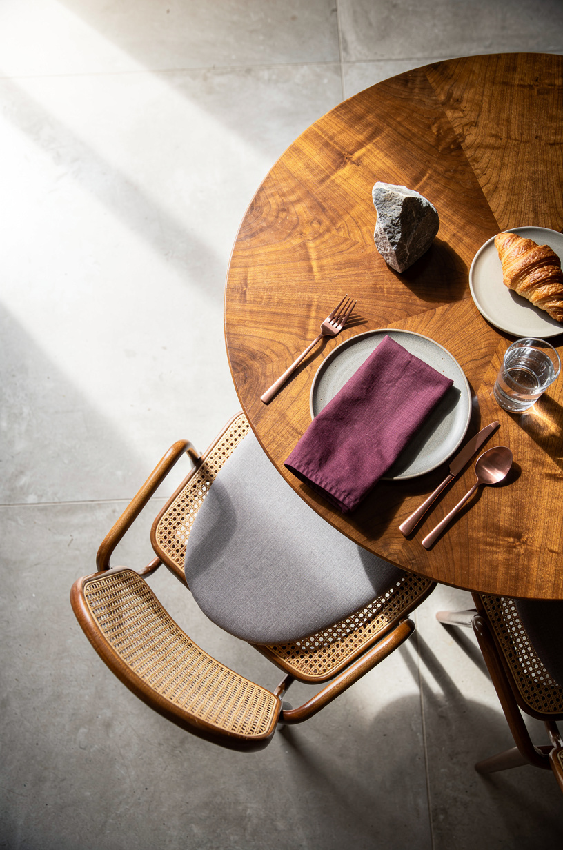 Pair cane chairs with a walnut cafe table