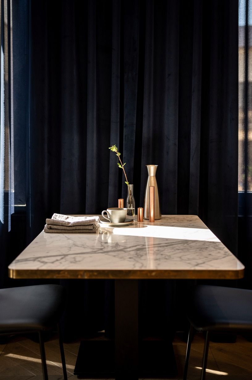 Set A Marble Bistro Table Beside Curtains