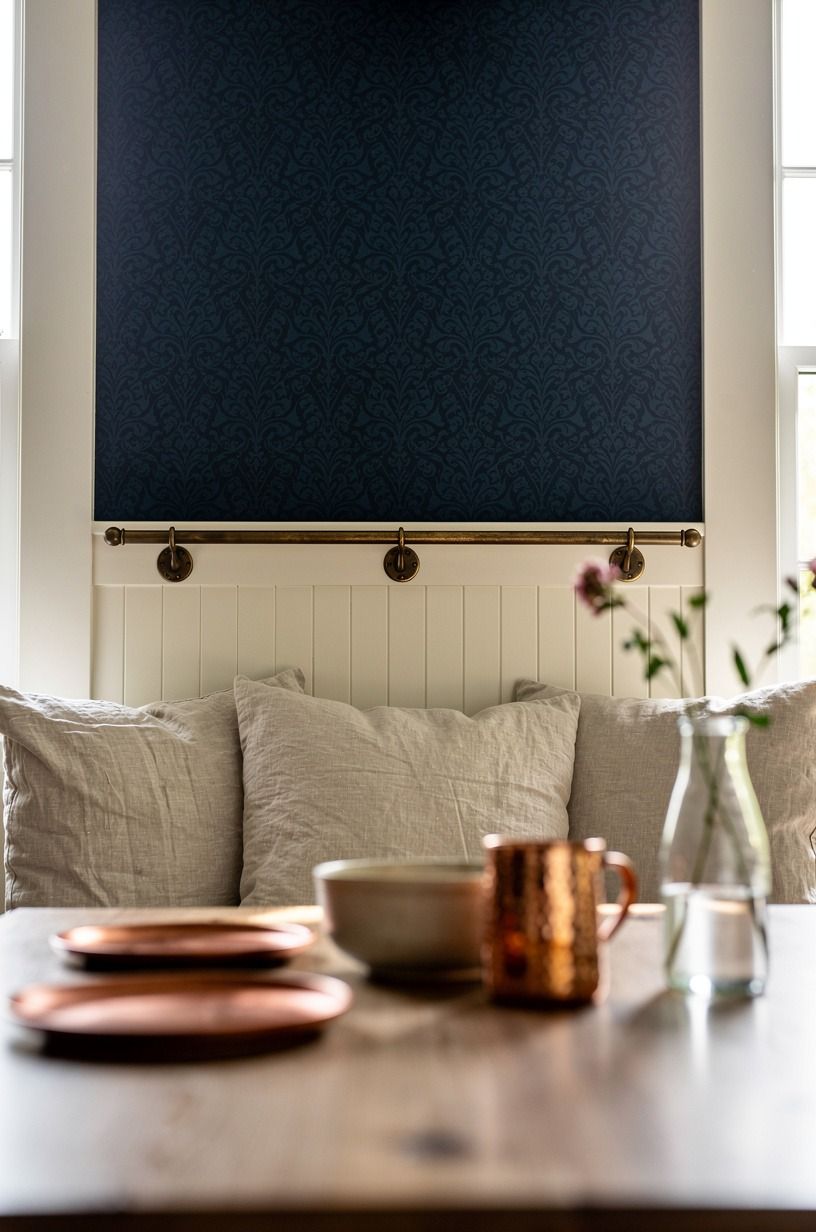 Run wallpaper above beadboard around the banquette