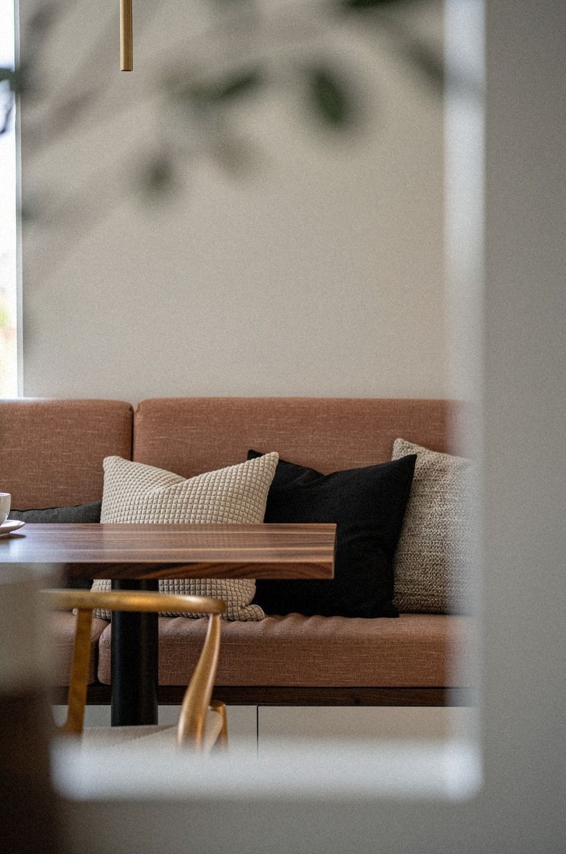 Layer sculptural pillows in oat and charcoal