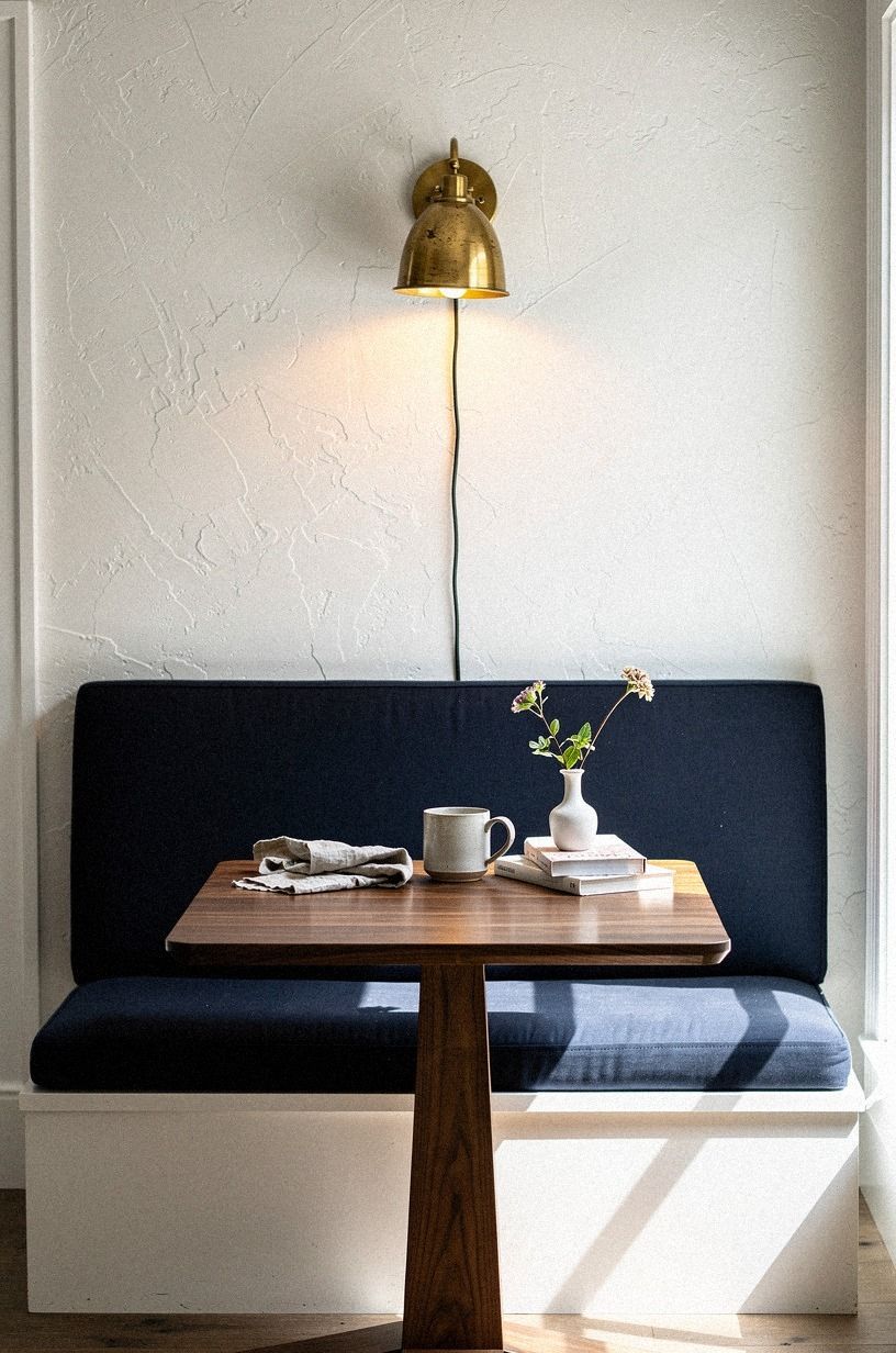 Add a plug-in sconce over the banquette