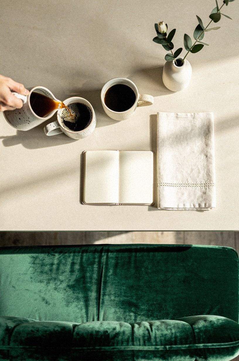 Pour morning coffee into handmade ceramic mugs