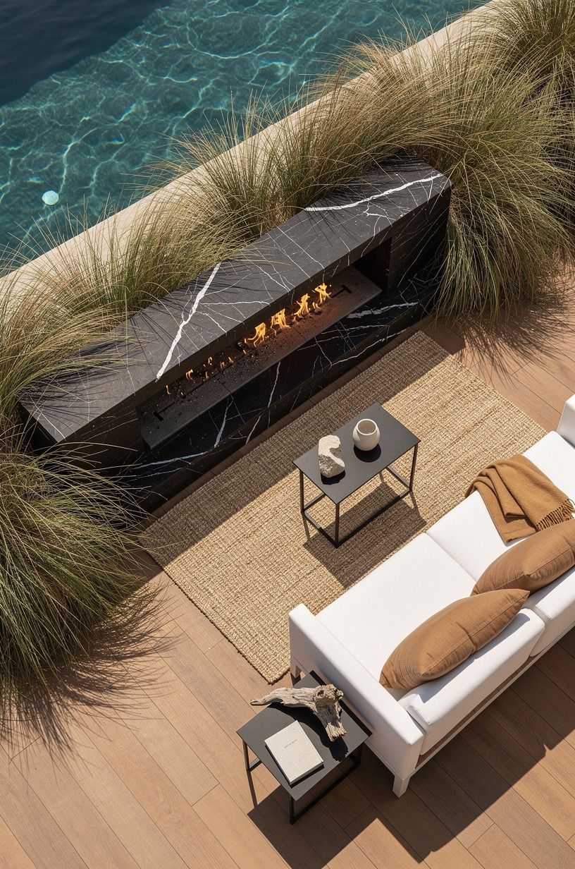 Frame a coastal outdoor fireplace design with tall grasses