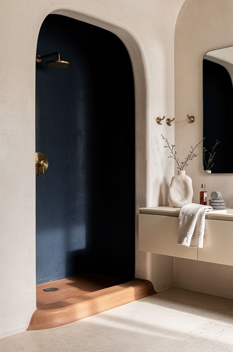 Carve out a shower with a clay-colored threshold