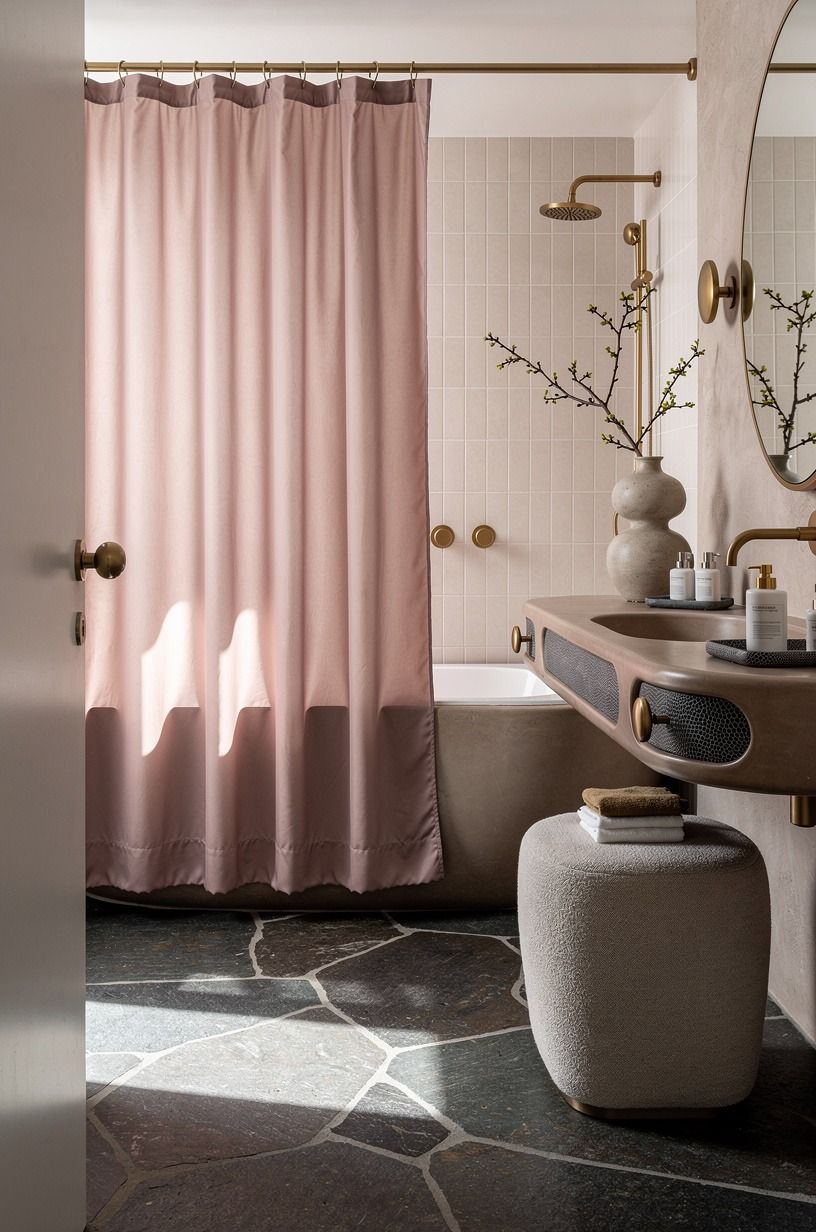 Choose a shower curtain that softens hard lines
