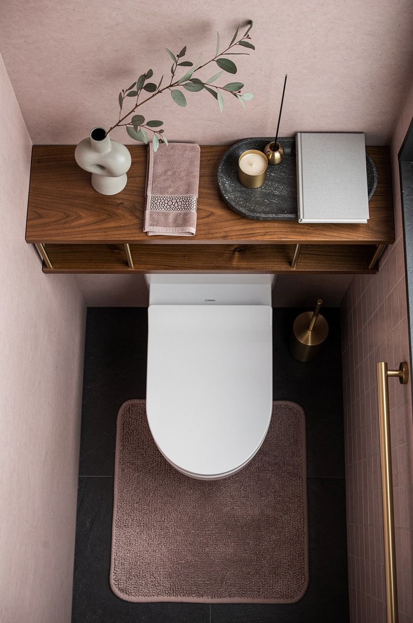 Frame the toilet zone with one deliberate shelf