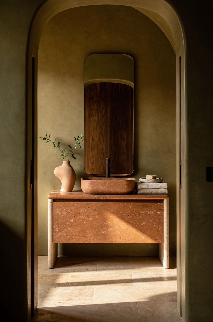 Hang a mirror that reaches toward the faucet