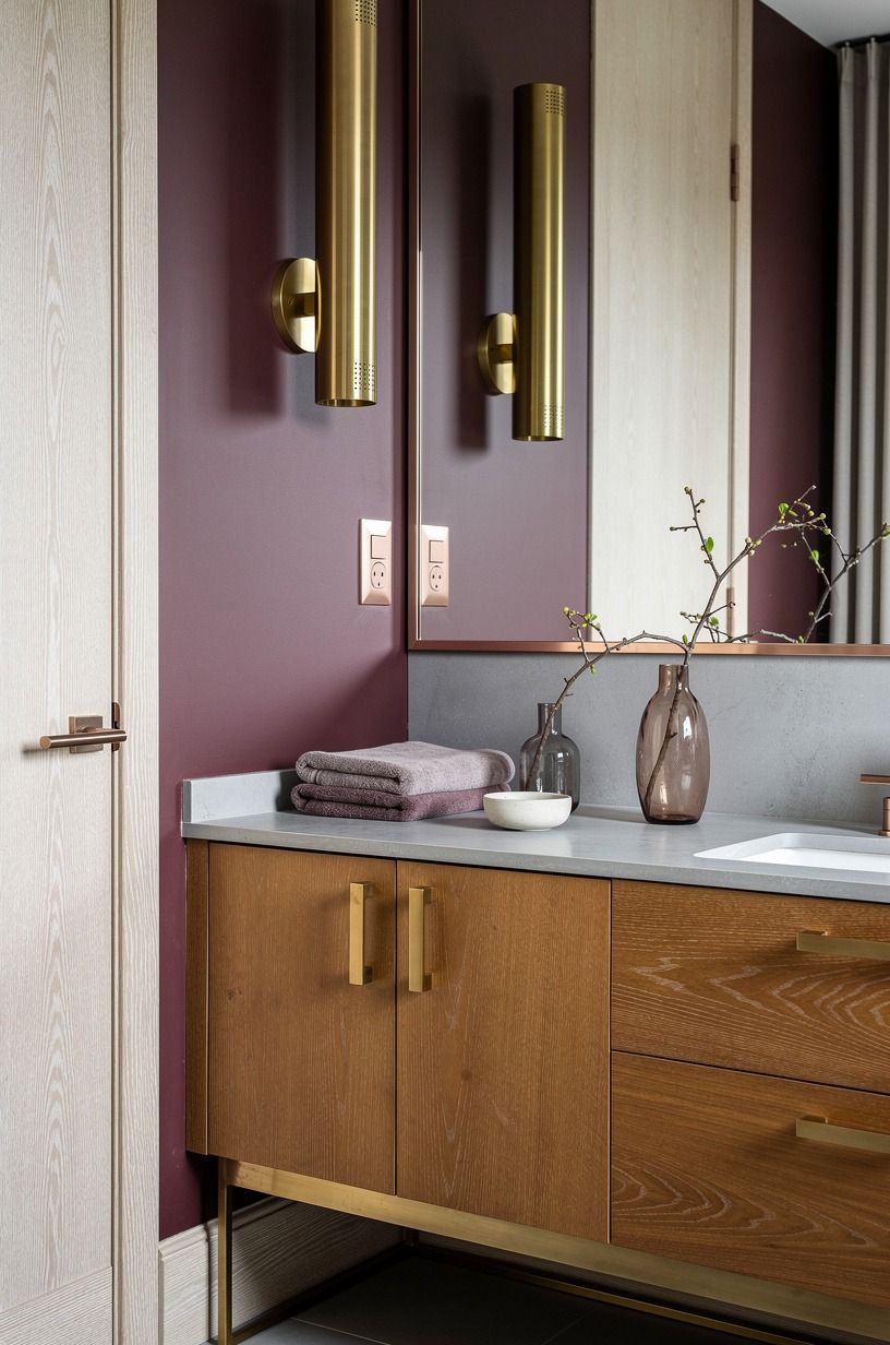 Hang unlacquered brass sconces low enough to matter
