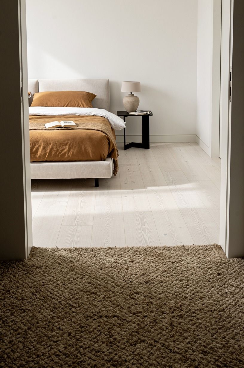 The floor needed wool, not another beige rug, warm white palette