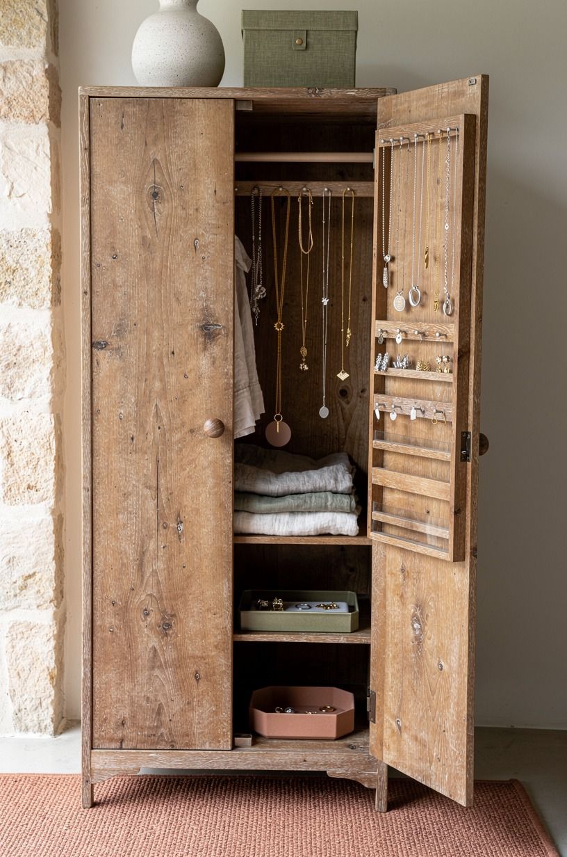 Hang necklaces inside a wardrobe door