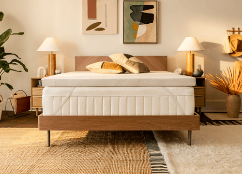 TEMPUR-Adapt topper on a bed showing the StayTight corner straps
