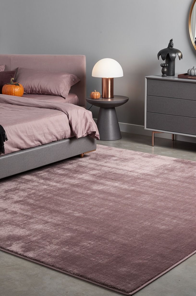 Anchor your pink Halloween bedroom with a measured rug