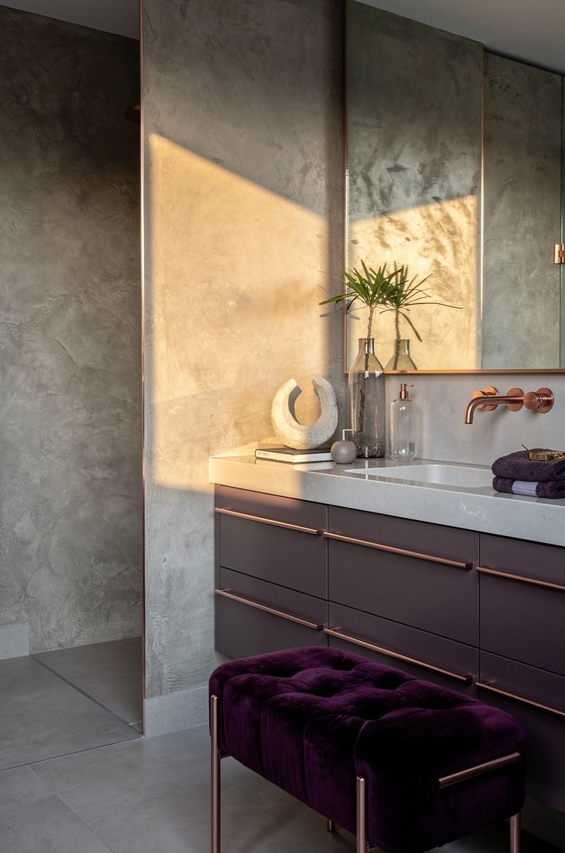 Swap bright tile for a hand-troweled concrete bathroom wall