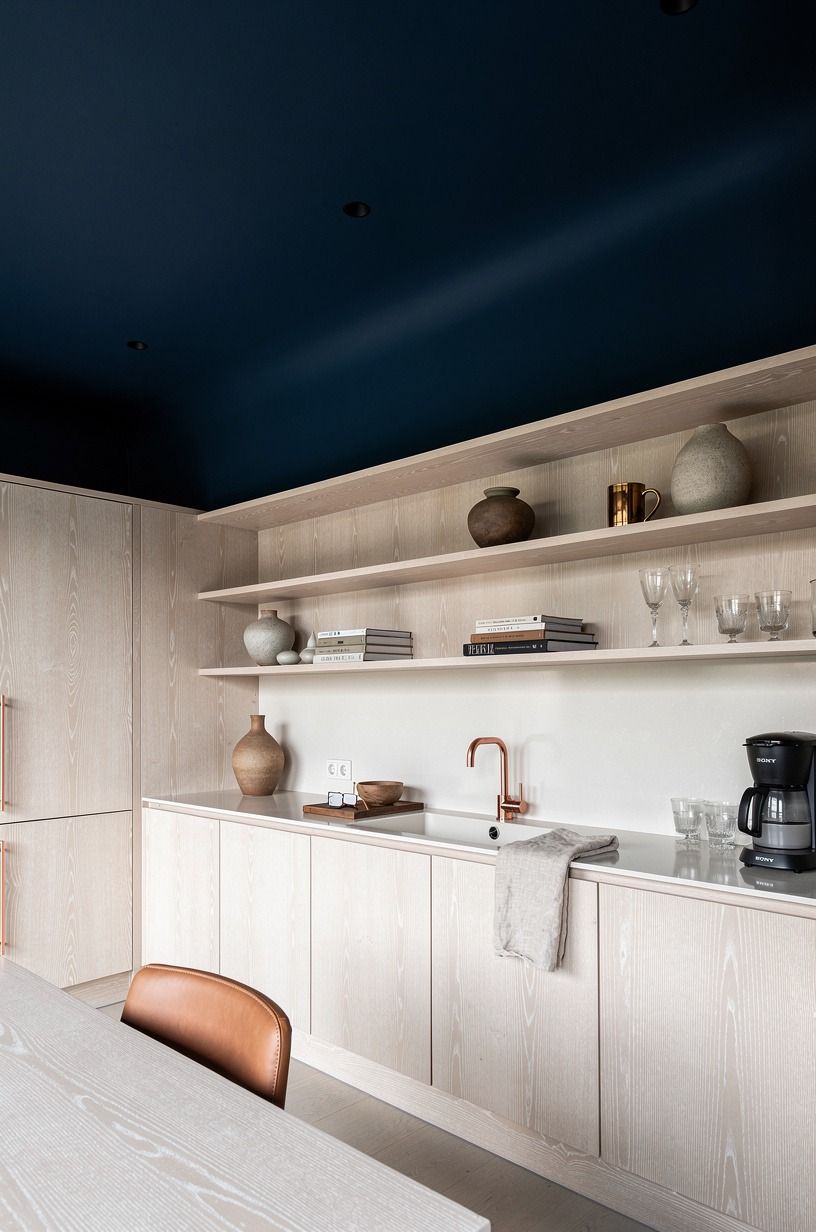 Paint the ceiling instead of adding more cabinets