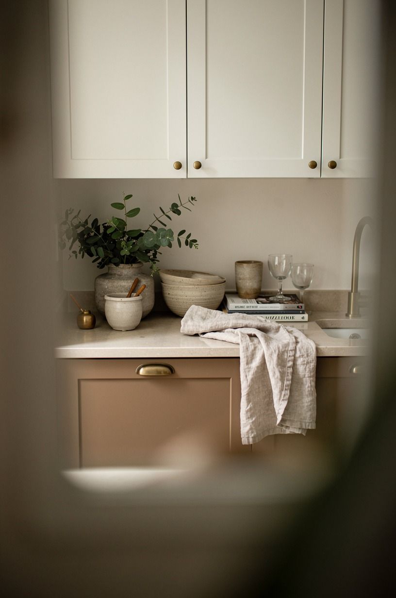 Paint the uppers in Benjamin Moore White Dove for a small closed off kitchen