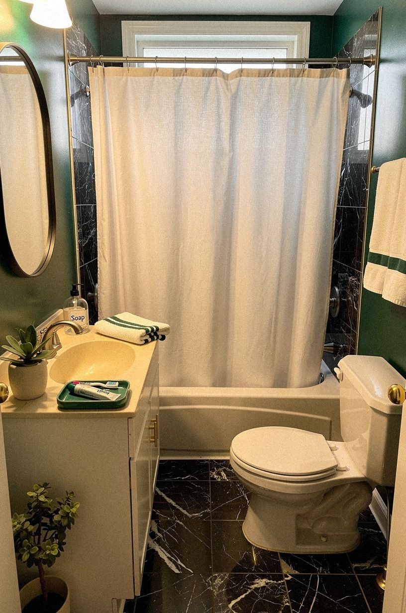 Hang the Shower Curtain High for a More Airy Room