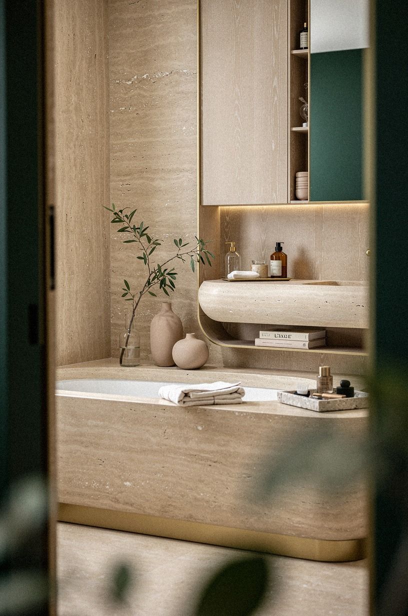 I let the travertine lead the Italian bathroom aesthetic, emerald palette