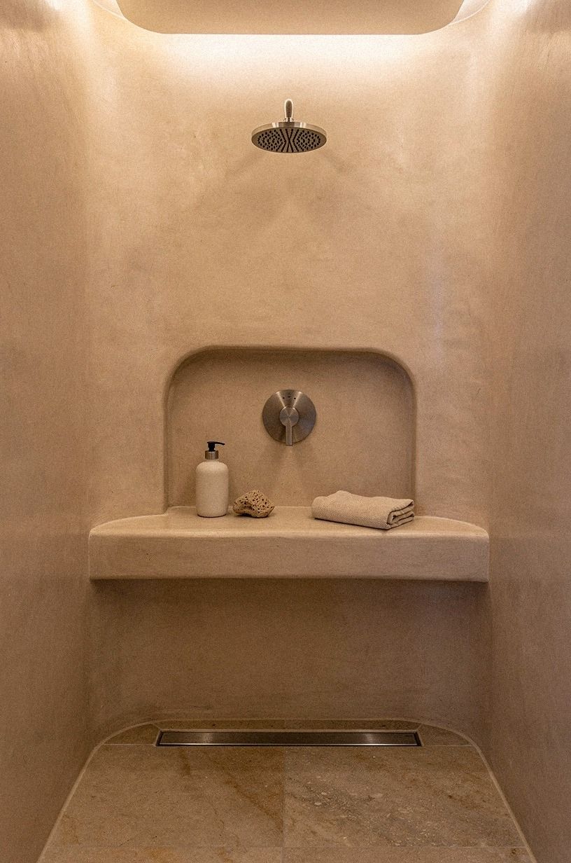 Carve a built-in shelf into the wet wall