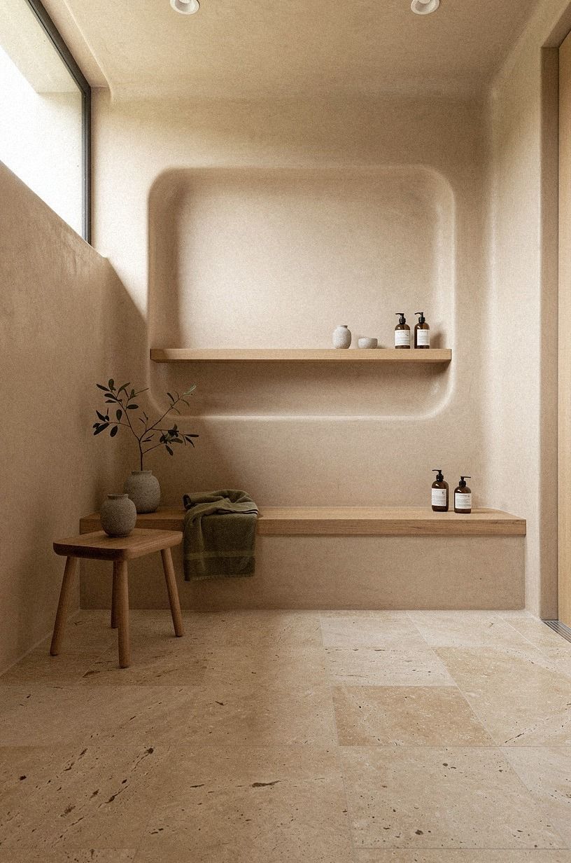 Layer a warm tadelakt shower with soft oak