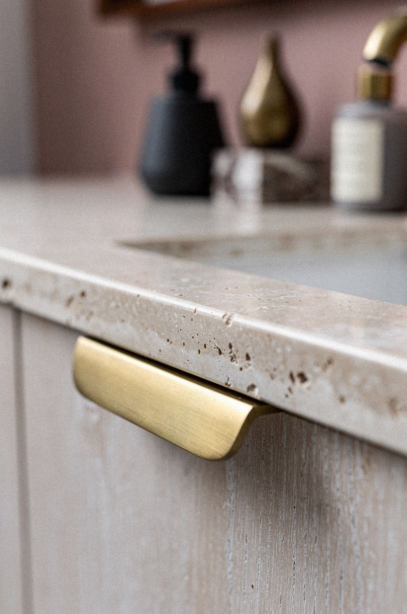 Mix a Limestone Counter with Brushed Brass