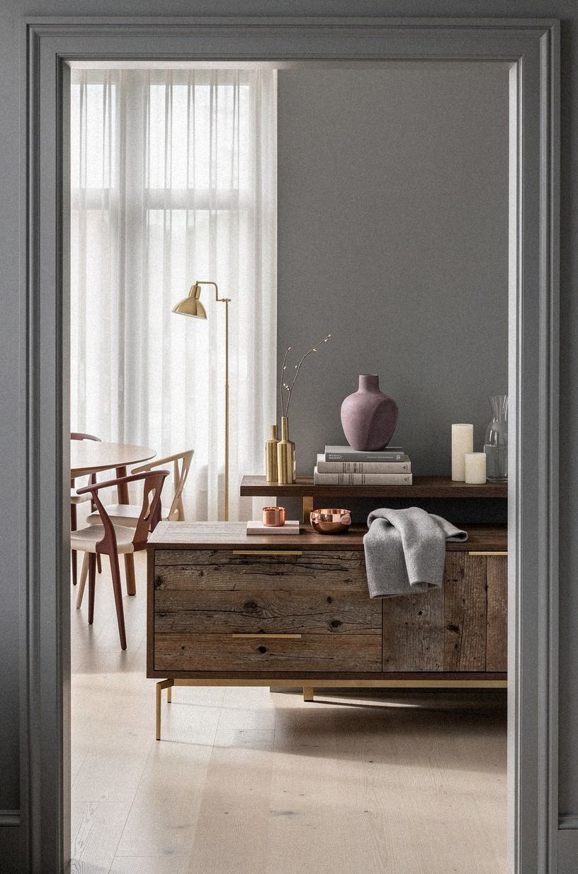 Use Sherwin-Williams Agreeable Gray in open rooms
