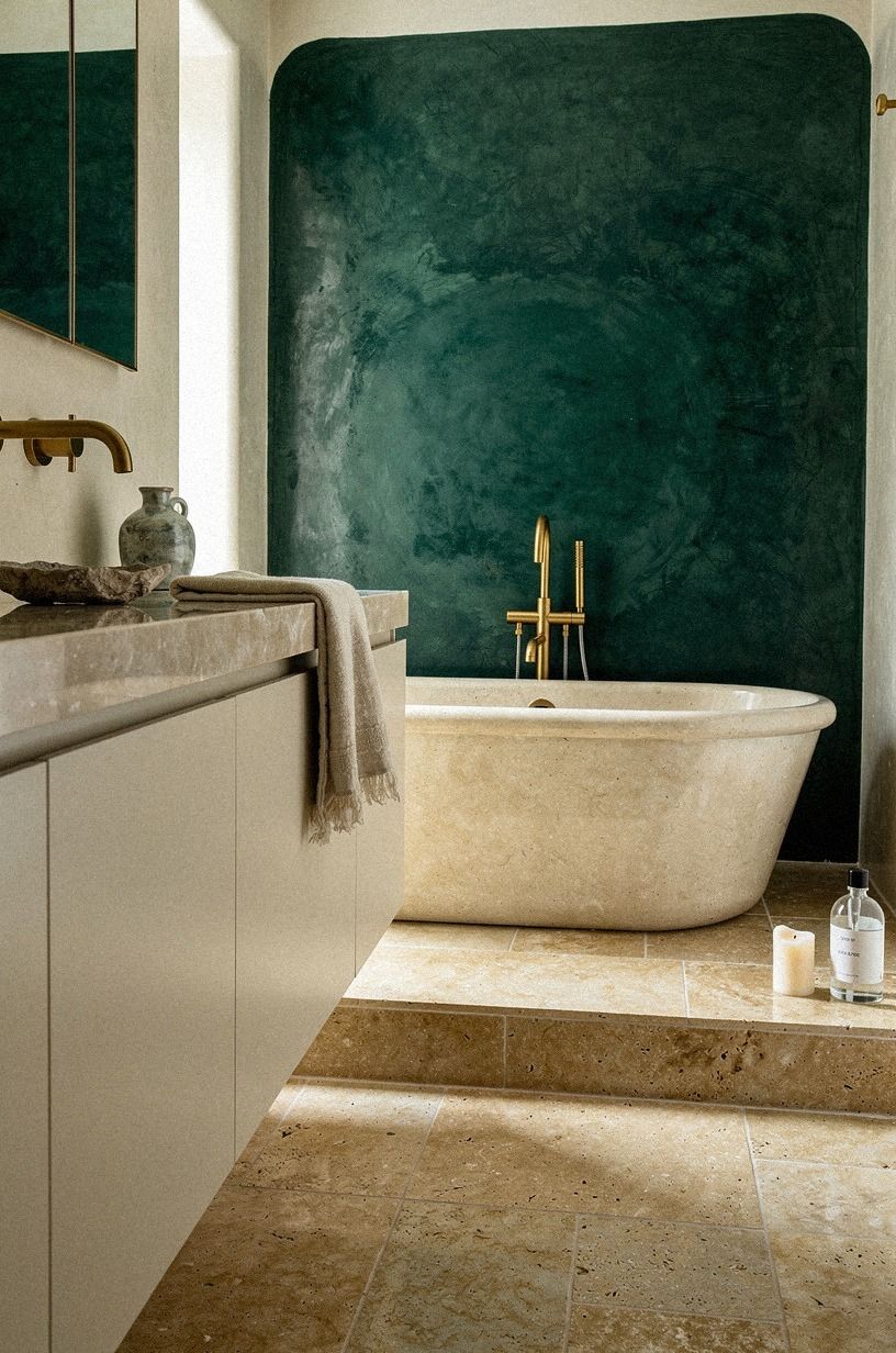 Start with a tactile plan for a tadelakt and warm travertine bathroom